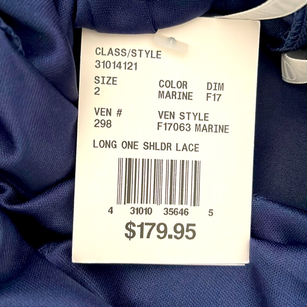 It is lace at the top and chiffon on the bottom. One shoulder with a zipper.